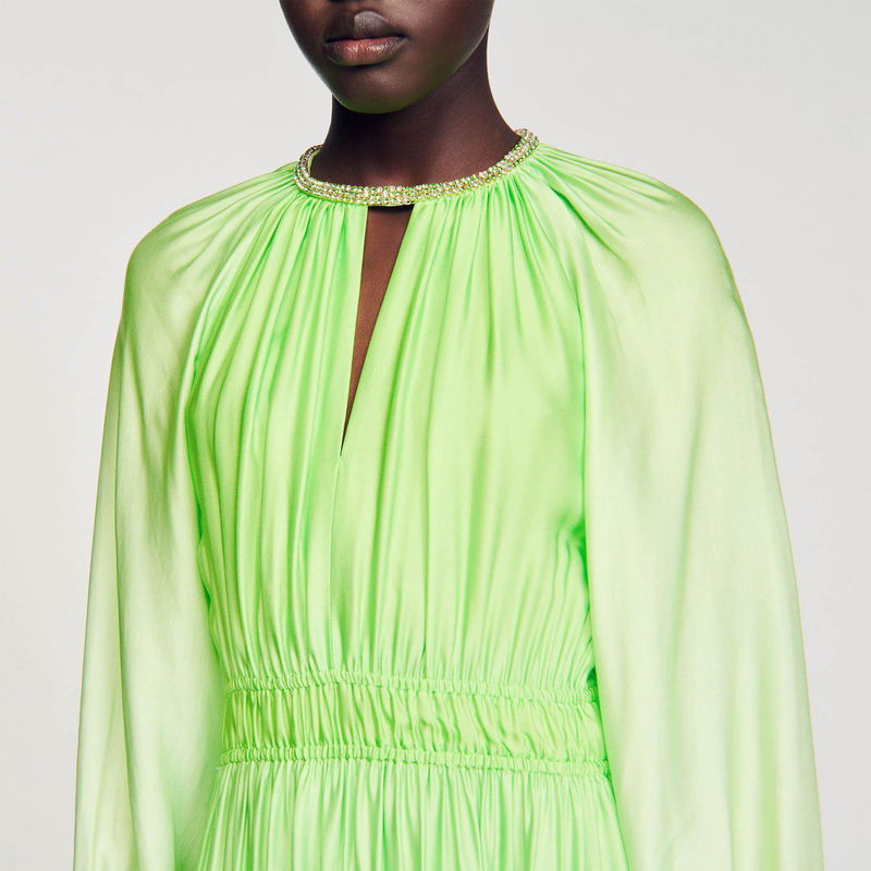 Satin dress with a plunging neckline and jeweled collar.