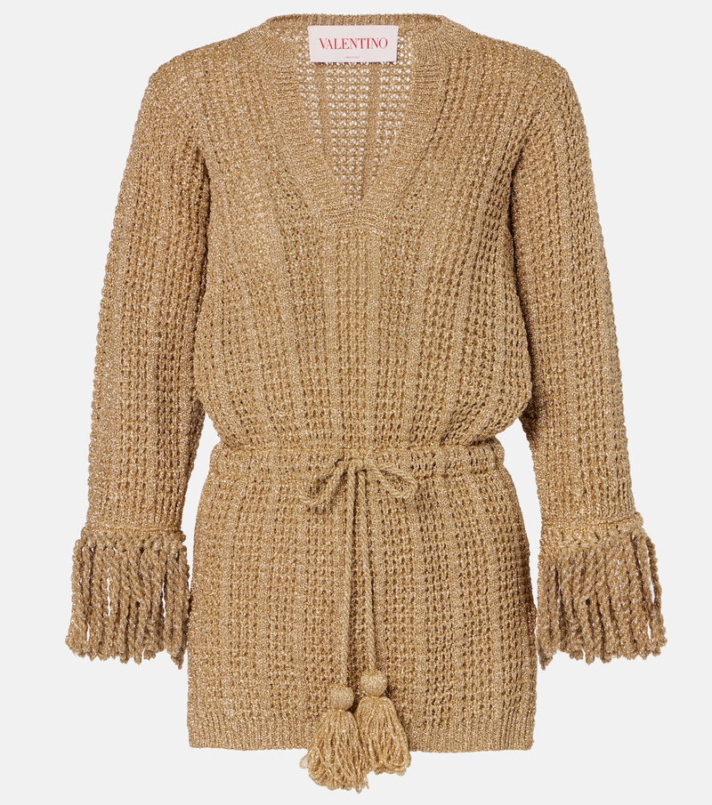 Gold knitted wrap dress with fringed sleeves and drawstring tie.