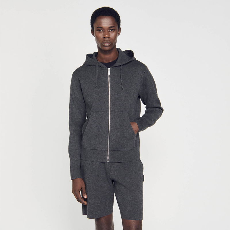 Gray hooded sweatshirt with zip-up front and pockets, worn by a Black man.