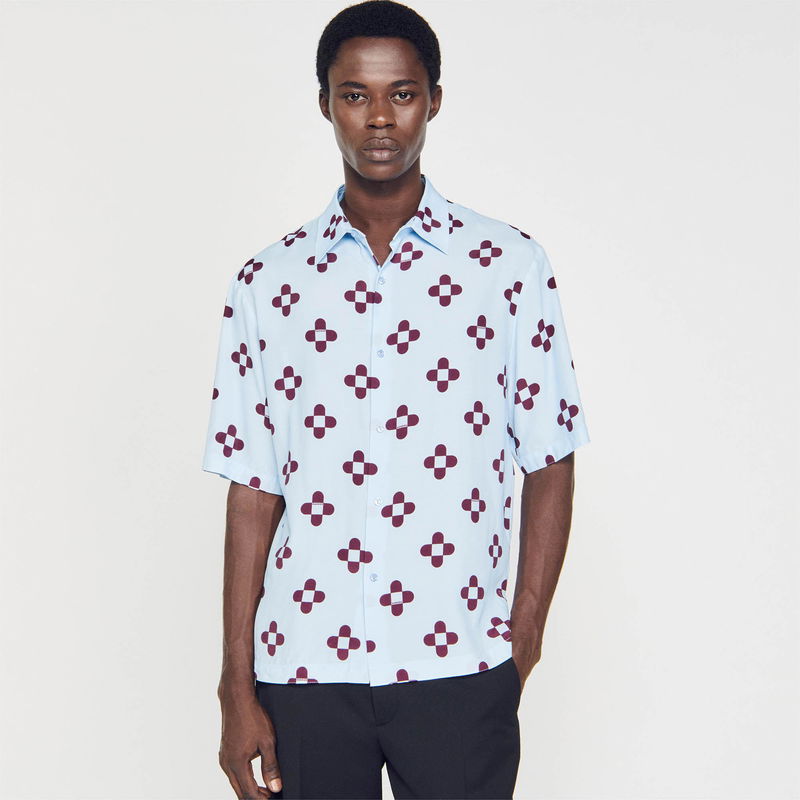 SANDRO man in light blue shirt with maroon floral print