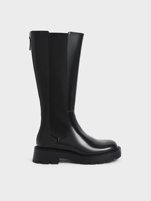 Black leather Chelsea knee-high boots with a chunky sole