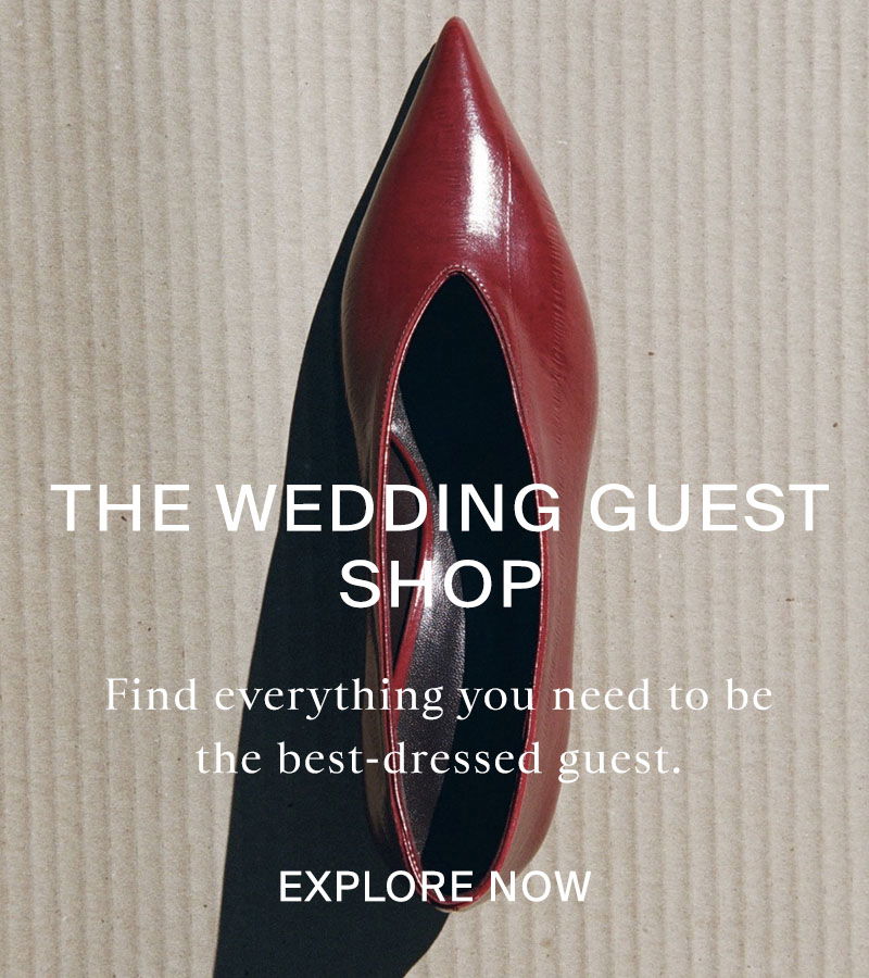 Red pointed shoe on corrugated card with shadow