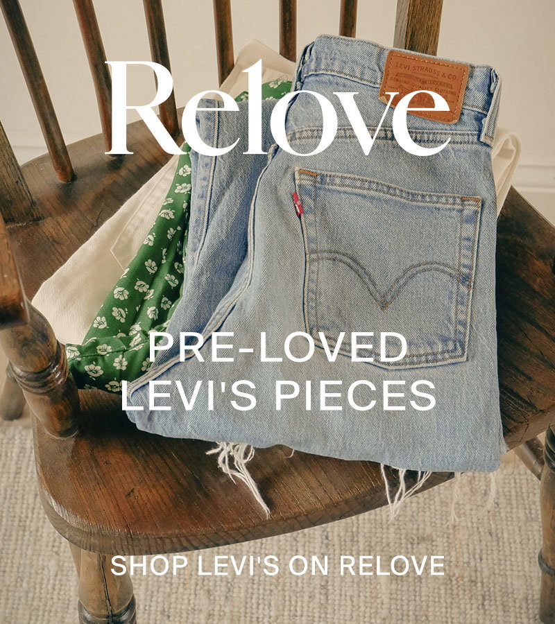 Levi jeans folded on a wooden chair