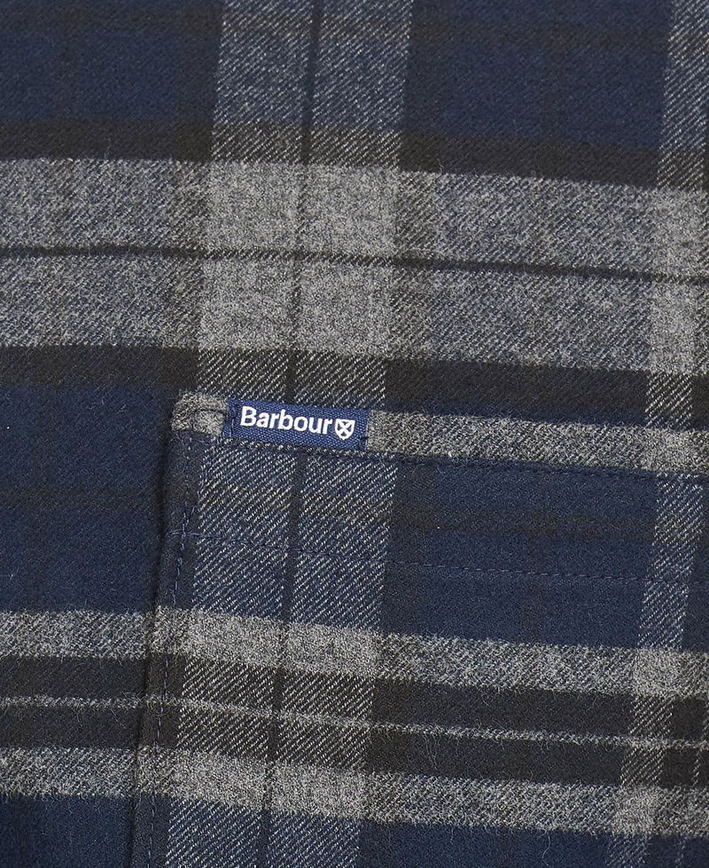 Navy blue Barbour flannel shirt with grey check pattern and logo patch.