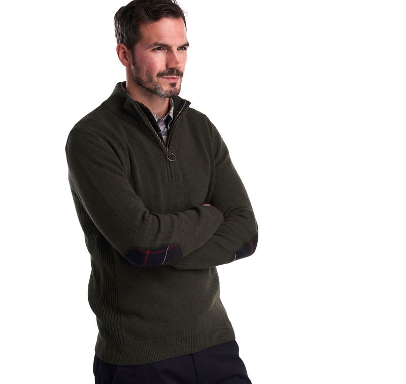 Olive green Barbour sweater with plaid cuffs and a half-zip closure.